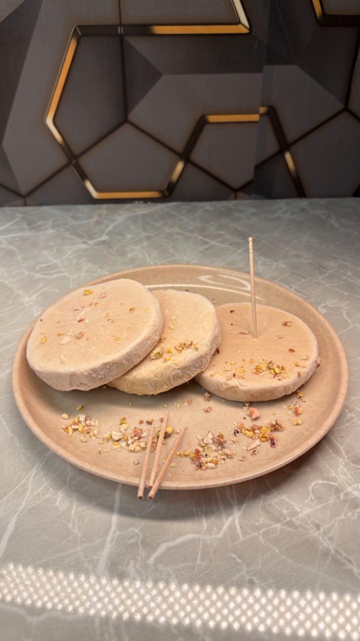 Rich, creamy malai kulfi slice made with full-fat milk and cardamom